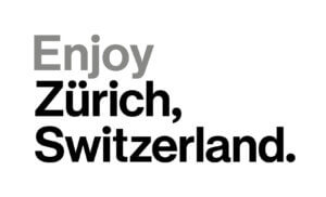 Der Text in großer, fetter Schrift lautet: „Enjoy Zürich, Schweiz“. Das Wort „Enjoy“ ist hellgrau, während „Zürich, Schweiz“ schwarz ist. Der Hintergrund ist weiß.