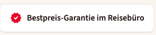 Ein rotes Siegel mit einem weißen Häkchen neben dem Text „Bestpreis-Garantie im Reisebüro“ auf weißem Hintergrund.